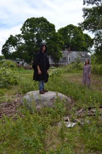 A student from The Compass School stands on what is believed to be Inscription Rock or Preacher’s Rock, on top of which Jemima Wilkinson used to preach (Hilary Downs-Fortune)