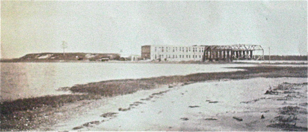 Gallaudet Aircraft factory under construction, around 1915. Note the absence of trees on the hill and low lying location of the factory, making it susceptible to storm-surge flooding (Neil Williams Ross Collection)