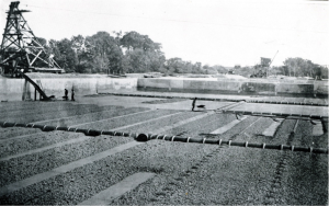 Drainage system in place, with first layer of gravel partly placed 